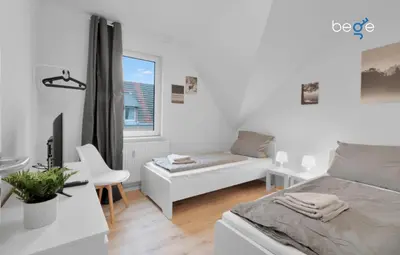 Ein Bett oder Betten in einem Zimmer der Unterkunft BEGE APARTMENTS SmartWork Lodge
