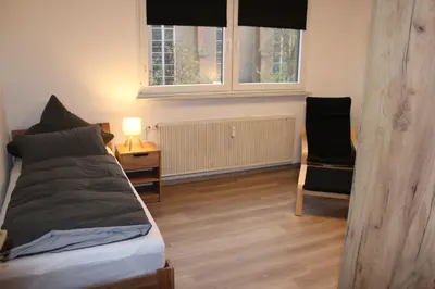 Ein Bett oder Betten in einem Zimmer der Unterkunft FeWo Oberhausen-Styrum