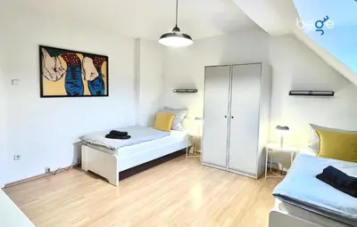 Ein Bett oder Betten in einem Zimmer der Unterkunft BEGE APARTMENTS WorkLodge
