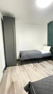 Ein Bett oder Betten in einem Zimmer der Unterkunft Home Apartments Four