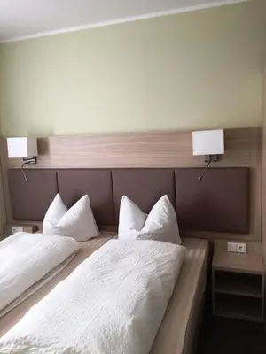 Ein Bett oder Betten in einem Zimmer der Unterkunft Hotel Restaurant Mirena