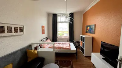 Ein Bett oder Betten in einem Zimmer der Unterkunft Frisch renovierte Ferienwohnung Abendrot für 2 Personen, zentral gelegen