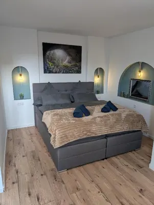 Ein Bett oder Betten in einem Zimmer der Unterkunft Villa Baumhaus Apartments