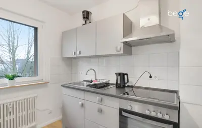 Küche/Küchenzeile in der Unterkunft BEGE APARTMENTS BusinessTranquil