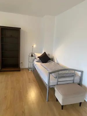 Ein Bett oder Betten in einem Zimmer der Unterkunft 3 Schlafzimmer und überdachtem Südbalkon in Haltern