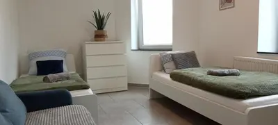Ein Bett oder Betten in einem Zimmer der Unterkunft TOPFLAT mit Küche I gratis Parkplatz I zwei Schlafzimmer I zentrumnah