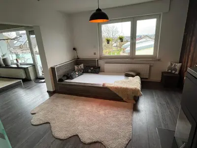 Ein Bett oder Betten in einem Zimmer der Unterkunft Sonnenblick Apartment sunview #rain-shower 2P bathtube BIG kitchen