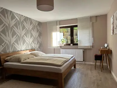 Ein Bett oder Betten in einem Zimmer der Unterkunft Ferienwohnung mit Infrarotsauna
