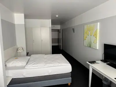 Ein Bett oder Betten in einem Zimmer der Unterkunft Hotel U Mülheim Free Parking Highspeed WiFi
