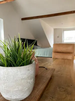 Ein Sitzbereich in der Unterkunft Moderne Wohnung mit offenem Wohnkonzept - Hagen Emst