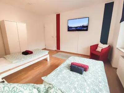 Ein Bett oder Betten in einem Zimmer der Unterkunft homes of ruhr - Monteurwohnung Hafenkiez