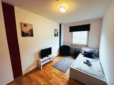 Ein Bett oder Betten in einem Zimmer der Unterkunft homes of ruhr - Monteurwohnung Förderturm