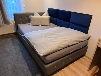 Ein Bett oder Betten in einem Zimmer der Unterkunft Hotel Am Vogelsang