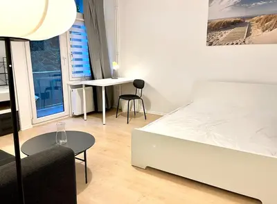 Ein Bett oder Betten in einem Zimmer der Unterkunft Tolles neues Apartment mit Balkon, EBK, Wlan, Smart TV, Netflix