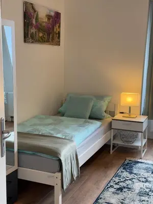 Ein Bett oder Betten in einem Zimmer der Unterkunft Monteurwohnung oder Messewohnung inklusive Fitness Studio