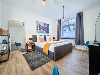 Ein Bett oder Betten in einem Zimmer der Unterkunft Alpha Apartments