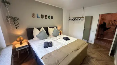 Ein Bett oder Betten in einem Zimmer der Unterkunft Cozy Apartment with Balcony I free Parking I WiFi