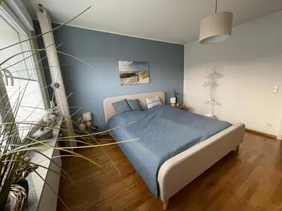 Ein Bett oder Betten in einem Zimmer der Unterkunft Gemütliches Doppelzimmer in ruhiger Lage