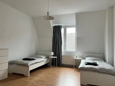 Ein Bett oder Betten in einem Zimmer der Unterkunft FirmenQuartier24 im DG in Wuppertal