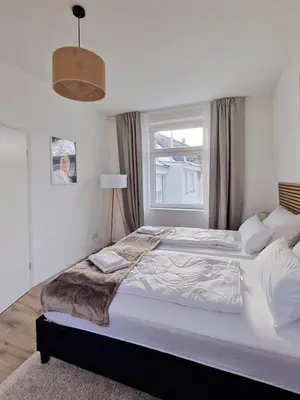 Ein Bett oder Betten in einem Zimmer der Unterkunft stayVision LS1 Wohnung 8 - 1 bedroom - 4 guests - top Wi-Fi