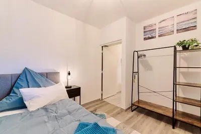 Ein Bett oder Betten in einem Zimmer der Unterkunft CASATUA - Balkon - Arbeitsplatz - Ruhig - Messe - WiFi