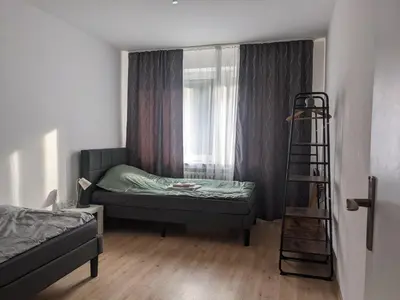 Ein Bett oder Betten in einem Zimmer der Unterkunft Monteurwohnung 1 Ferienwohnung Business Appartement Velbert 6 Personen