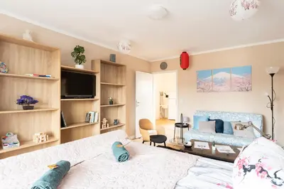 Ein Bett oder Betten in einem Zimmer der Unterkunft - Zen Haven Luxurious 3-Room Japanese-Themed Apartment with King-Size Beds, Balcony, Bamboo Accents, Entertainment Galore & Private Parking - Near Airport & Train Station -