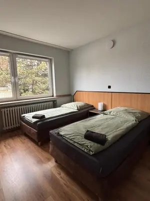 Ein Bett oder Betten in einem Zimmer der Unterkunft Case One Monteur Aparthotel