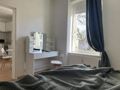 Ein Bett oder Betten in einem Zimmer der Unterkunft Gemütliches Mansarden-Apartment mit 2 Schlafzimmern & separater Küche
