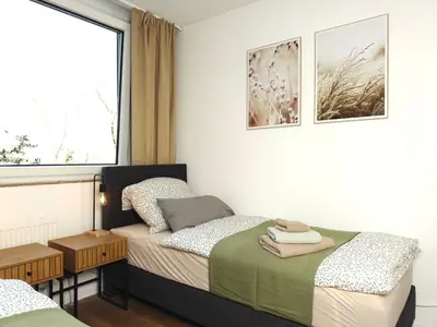 Ein Bett oder Betten in einem Zimmer der Unterkunft 6 Bed Upscale Apartment