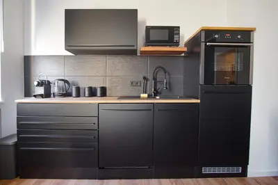 Küche/Küchenzeile in der Unterkunft EssenFusion Wasserturm - Innenstadt nahe der Messe, SmartTV, Nespresso, Fully Kitchen