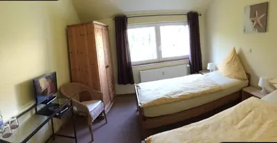 Ein Bett oder Betten in einem Zimmer der Unterkunft Hotel Reesenhof