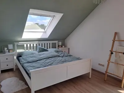 Ein Bett oder Betten in einem Zimmer der Unterkunft Ferienwohnug mit Balkon und Carport