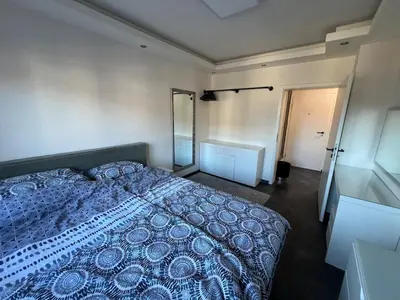 Ein Bett oder Betten in einem Zimmer der Unterkunft Modernes zentrales Appartement