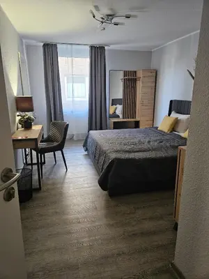 Ein Bett oder Betten in einem Zimmer der Unterkunft N Hotel