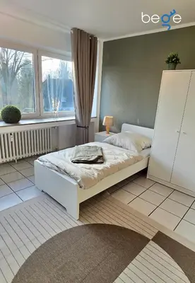Ein Bett oder Betten in einem Zimmer der Unterkunft BEGE APARTMENTS WorkEase