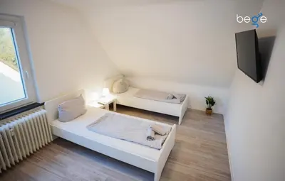 Ein Bett oder Betten in einem Zimmer der Unterkunft BEGE APARTMENTS Work Essentials