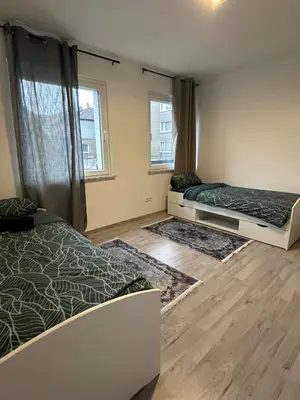Ein Bett oder Betten in einem Zimmer der Unterkunft Monteurswohnung am Schloss 1