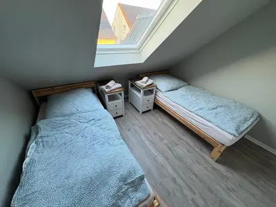 Ein Bett oder Betten in einem Zimmer der Unterkunft Andrews Motobike Apartment