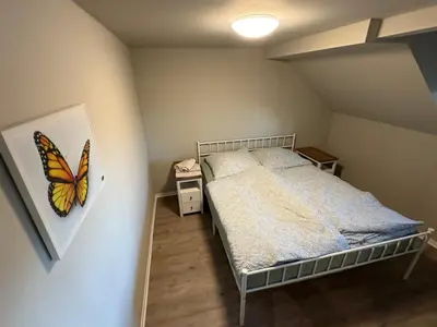 Ein Bett oder Betten in einem Zimmer der Unterkunft Andrews Motobike Apartment