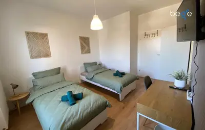 Ein Bett oder Betten in einem Zimmer der Unterkunft BEGE APARTMENTS Business Escape