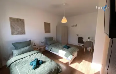Ein Bett oder Betten in einem Zimmer der Unterkunft BEGE APARTMENTS Business Escape