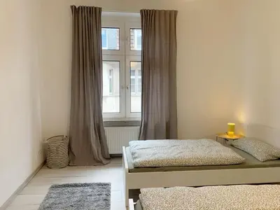 Ein Bett oder Betten in einem Zimmer der Unterkunft Schöne Altbauwohnung in Wuppertal