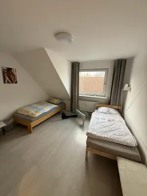 Ein Bett oder Betten in einem Zimmer der Unterkunft Monteurzimmer Schölerpad