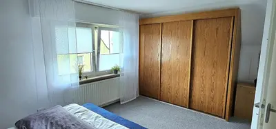 Ein Bett oder Betten in einem Zimmer der Unterkunft Gemütliche Dachgeschoßwohnung mit Balkon in Dortmund