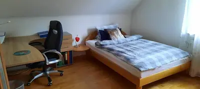 Ein Bett oder Betten in einem Zimmer der Unterkunft Ferienwohnung mit Ruhrtalblick
