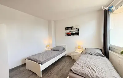 Ein Bett oder Betten in einem Zimmer der Unterkunft BEGE APARTMENTS Company Spot
