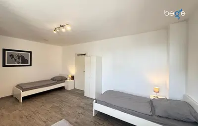 Ein Bett oder Betten in einem Zimmer der Unterkunft BEGE APARTMENTS Company Spot