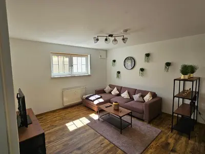 Ein Sitzbereich in der Unterkunft Ferienwohnung In den Birgden