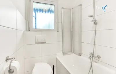 Ein Badezimmer in der Unterkunft BEGE APARTMENTS CompanyLife